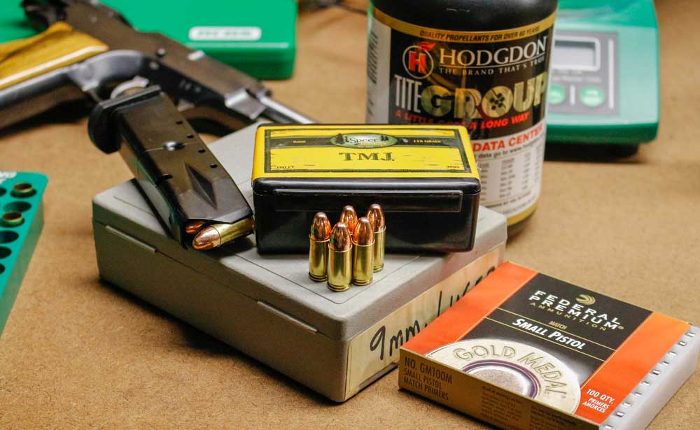 photo of 9mm ammo, magazine and boxes
