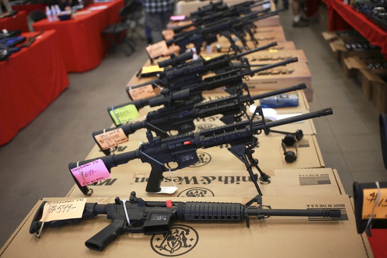 a line up of AR-15 rifles put on for display