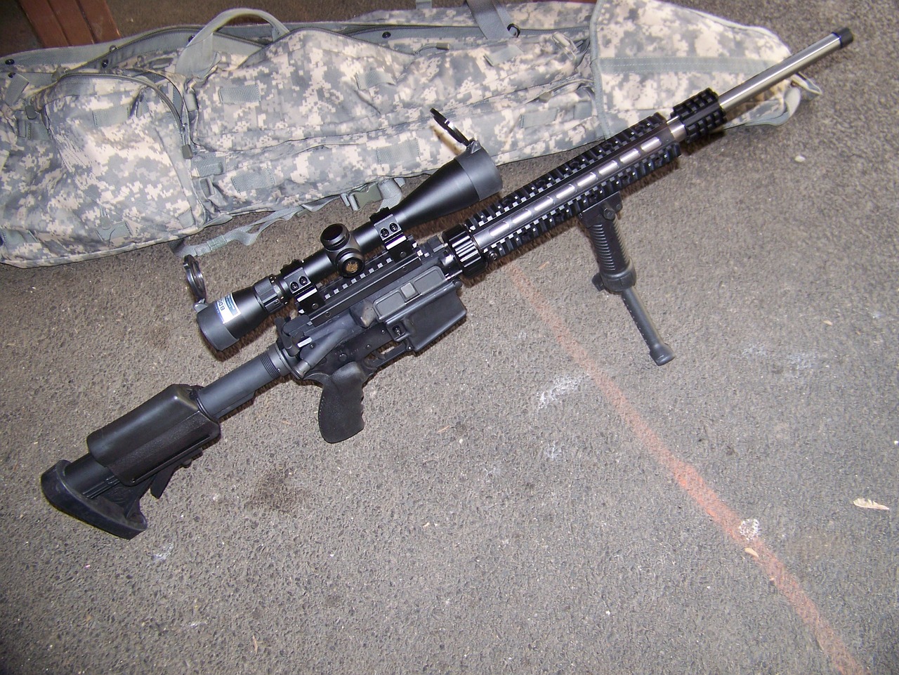 photo of an AR-15 Rifle with bipod and scope